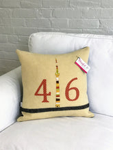 Load image into Gallery viewer, Cream pillow with modern black stripe. Rust numbers and coordinating CN Tower
