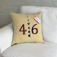 Load image into Gallery viewer, Cream pillow with modern red plaid numbers and black CN Tower.
