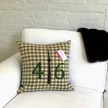Load image into Gallery viewer, Felted Wool Blanket Pillow - Cream background with chocolate brown squares. Moss green numbers and brown/green plaid CN Tower.
