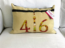Load image into Gallery viewer, Felted Wool Blanket Pillow - Cream background with fine black stripe. Coordinating rust, mustard &amp; moss green numbers and CN Tower
