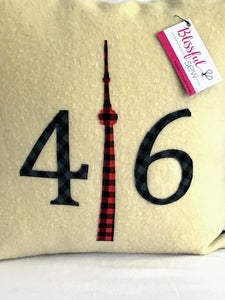 Felted Wool Blanket Pillow - Cream colored background with navy check numbers and red plaid CN Tower.