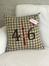 Load image into Gallery viewer, Felted Wool Blanket Pillow - Cream background with chocolate brown squares. Brown/green plaid numbers and cranberry plaid CN Tower.
