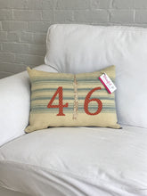 Load image into Gallery viewer, Cream pillow with blue stripes. Rust numbers and cream CN Tower
