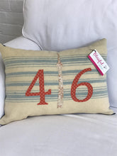 Load image into Gallery viewer, Felted Wool Blanket Pillow - Cream background with multiple robins egg blue stripes. Rust colored numbers and mottled cream CN Tower
