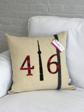 Load image into Gallery viewer, Felted Wool Blanket Pillow - Cream colored background with solid black stripe up the side.  Red plaid numbers and black CN Tower.
